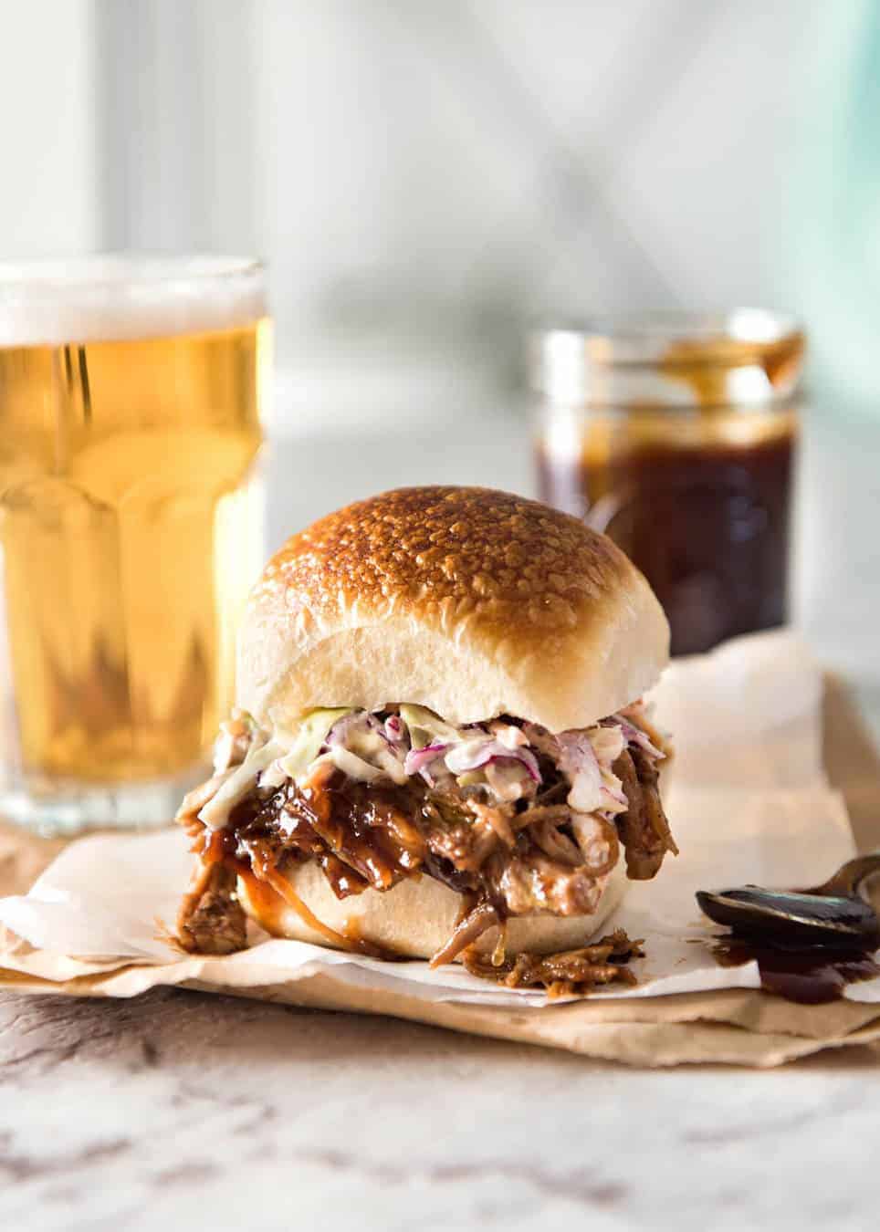 Slow Cooker BBQ Pulled Pork Sandwich - Perfectly seasoned, tender pulled pork tossed in a homemade BBQ sauce, piled onto bread with coleslaw. Slow cooker, pressure cooker or oven. www.recipetineats.com