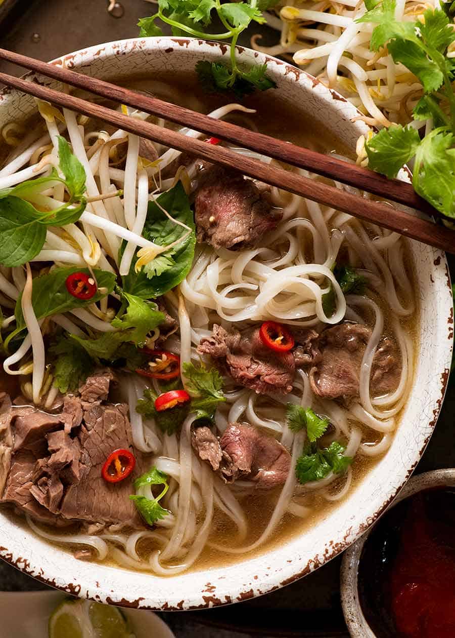 Beef pho recipe - overhead photo of pho in a bowl, ready to be eaten