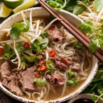 Beef Pho in a bowl, ready to be eaten