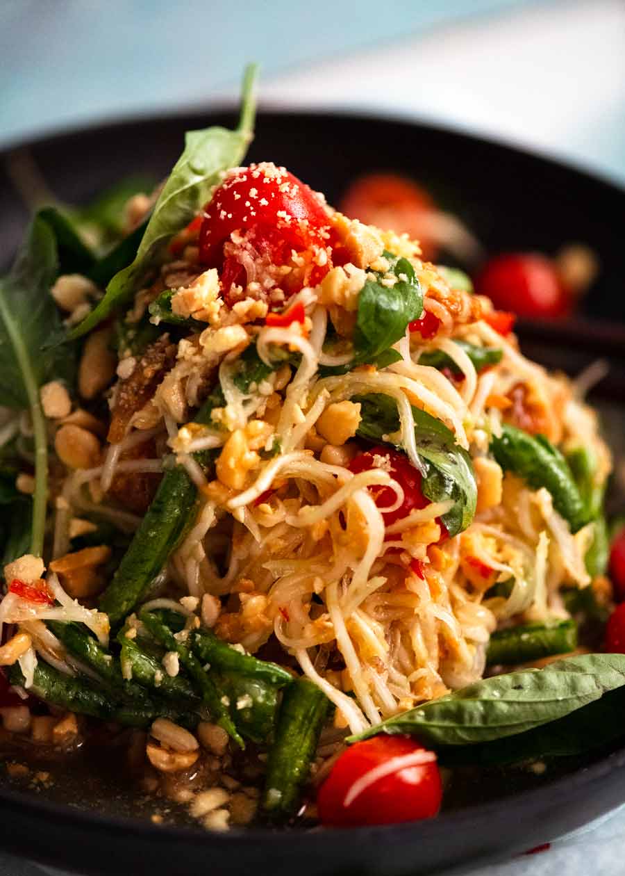 Close up of a pile of Green Papaya Salad (Thai) on a plate