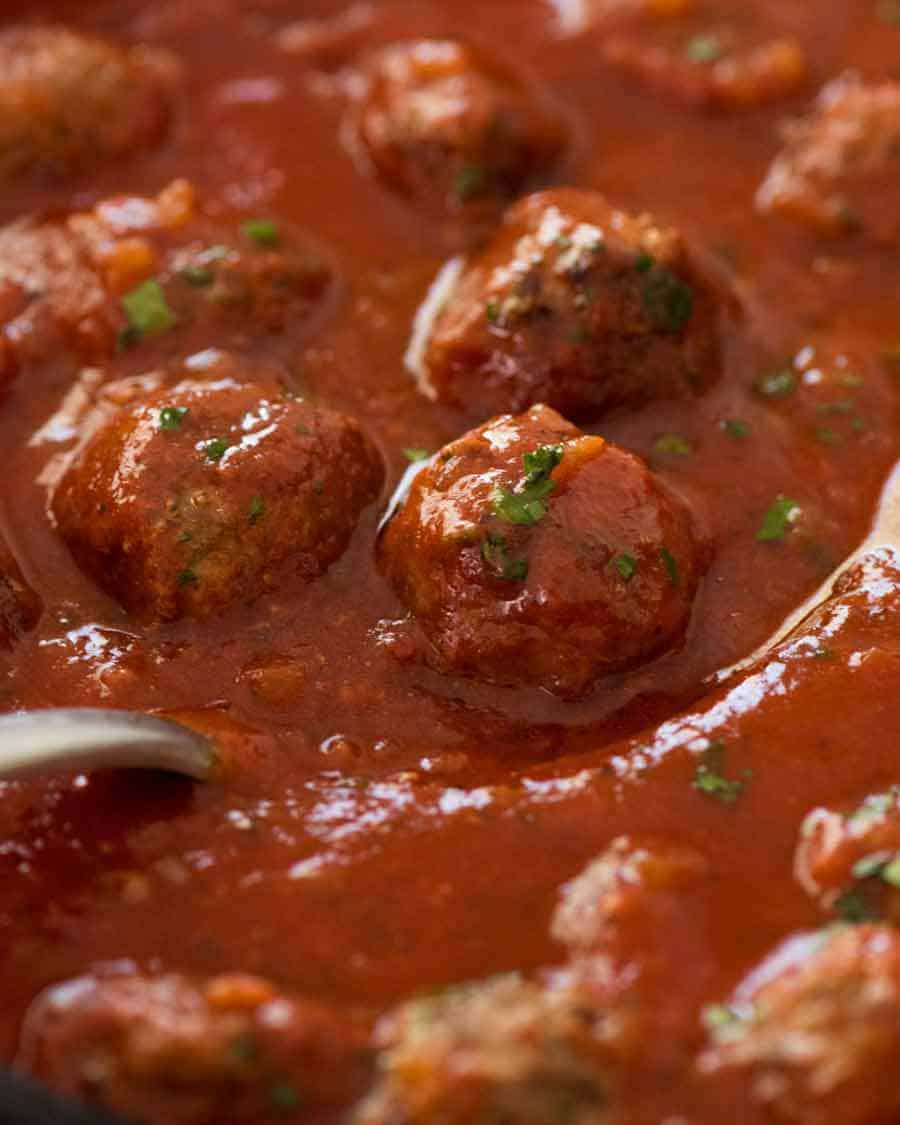 Close up of Italian Meatballs simmering in marinara sauce