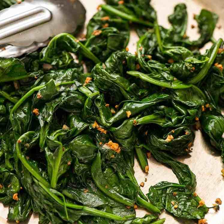 Garlic Sautéed Spinach in a skillet, ready to be served